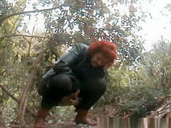 Mature redhead pee in the forest