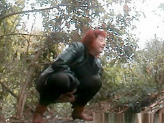 Mature redhead pee in the forest