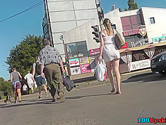 Milf's ass looks hot under mini skirt in upskirts mov