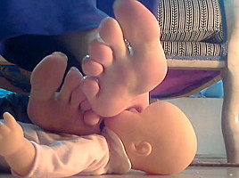 Mistress using her doll as footstool