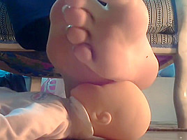 Mistress using her doll as footstool