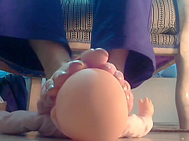 Mistress using her doll as footstool