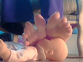 Mistress using her doll as footstool