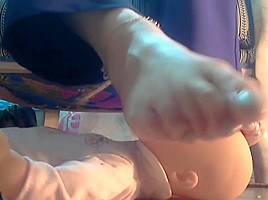 Mistress using her doll as footstool