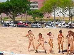 Naked singing and dancing girls put on a public show