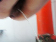 Pissing girl shot with a cam from under and above