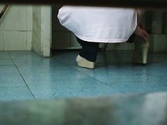 Pissing girl shot with a cam from under and above