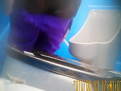 Purple pants woman pissing