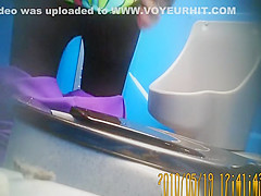 Purple pants woman pissing