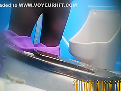 Purple pants woman pissing