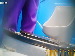 Purple pants woman pissing