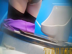 Purple pants woman pissing