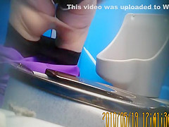 Purple pants woman pissing
