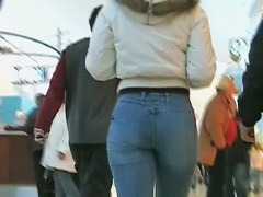 Sexy Latina girl in jeans followed by