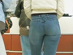 Sexy Latina girl in jeans followed by