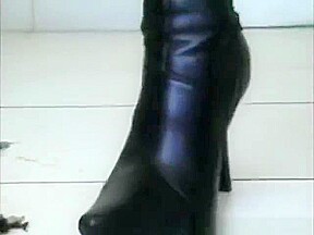 Sexy little asian in high heel leather boots crushing roaches