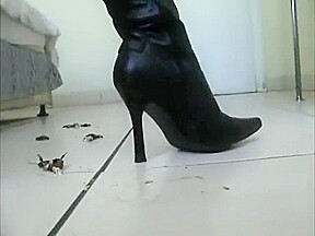 Sexy little asian in high heel leather boots crushing roaches