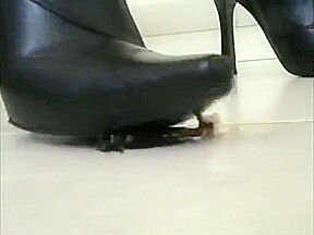 Sexy little asian in high heel leather boots crushing roaches