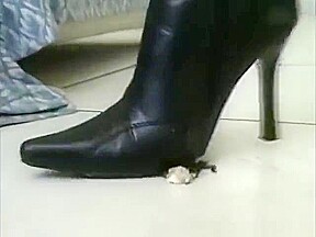 Sexy little asian in high heel leather boots crushing roaches