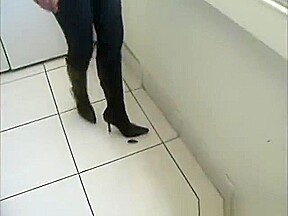 Sexy little asian in high heel leather boots crushing roaches