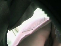 Sexy upskirt view with cute babe in pink skirt