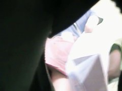 Sexy upskirt view with cute babe in pink skirt
