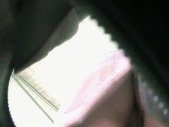 Sexy upskirt view with cute babe in pink skirt