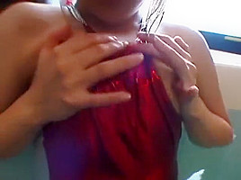 Shiny red metalic swimsuit in the pool