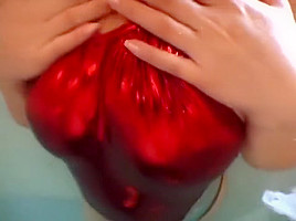 Shiny red metalic swimsuit in the pool