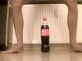 Small immature tries to ride a bottle