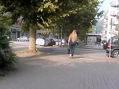 Spy beautiful blonde's ass in tight jeans and wedges