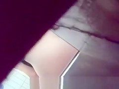 Spying blonde in toilet
