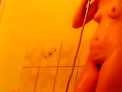 Sweet buttocks spied while she showers
