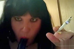 Ts Natalie Jenkins Smoking and sucking on a dildo