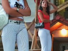 Two ladies with sexy asses walking down the street