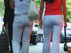 Two ladies with sexy asses walking down the street
