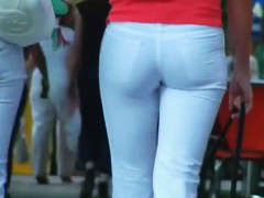 Two ladies with sexy asses walking down the street