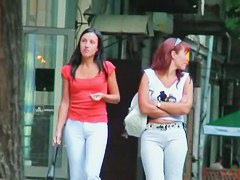 Two ladies with sexy asses walking down the street