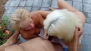 Two mature blondes sucking one black dick