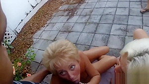 Two mature blondes sucking one black dick