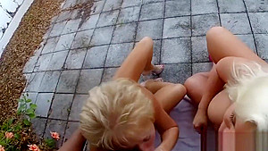 Two mature blondes sucking one black dick