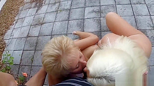Two mature blondes sucking one black dick