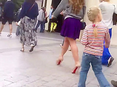 Upskirt look under milf's purple skirt