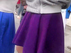 Upskirt look under milf's purple skirt