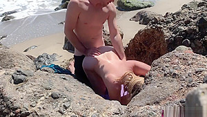 Voluptuous blonde sunbathing nude on the beach fucks passer-by - Erin Electra