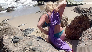 Voluptuous blonde sunbathing nude on the beach fucks passer-by - Erin Electra