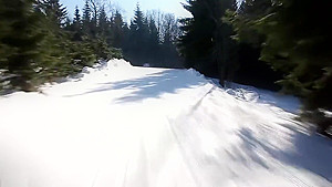 Woman skiing naked and masturbating lying on the snow