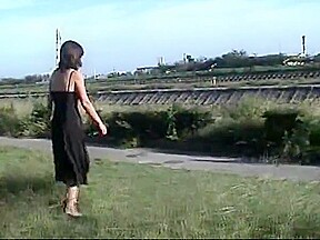 You can see a wet pussy from the long slit of the dress