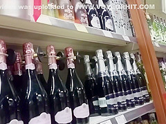 Young Couple Chooses Champagne