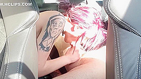 Young tattooed girl with pink hair